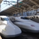 Two Shinkansen trains waiting to depart.